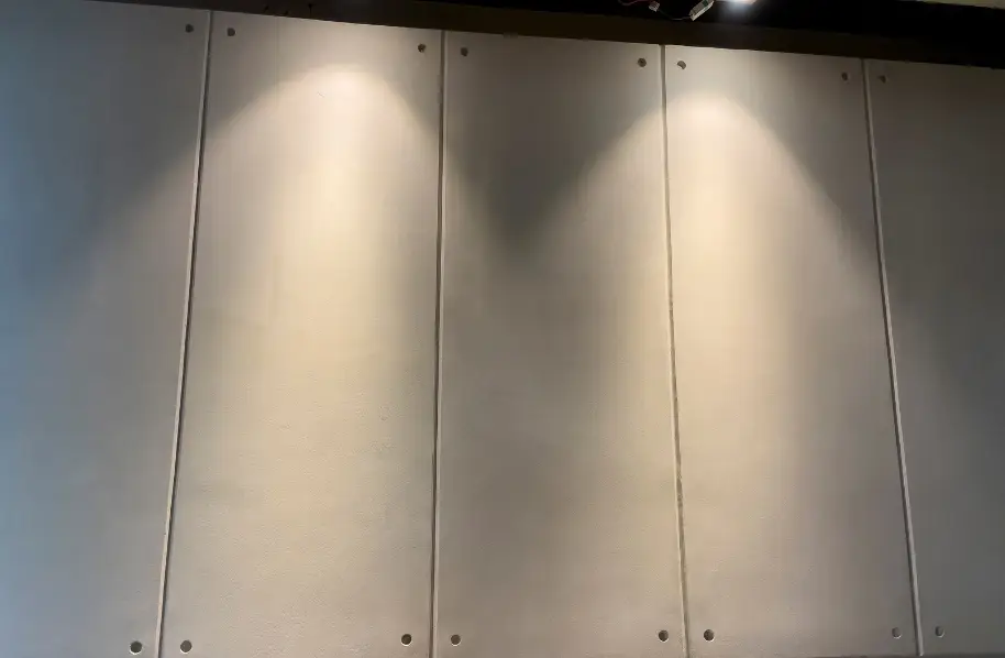 Concrete texture feature wall with fair face plaster finish at Fitletics Gym Rawalpindi